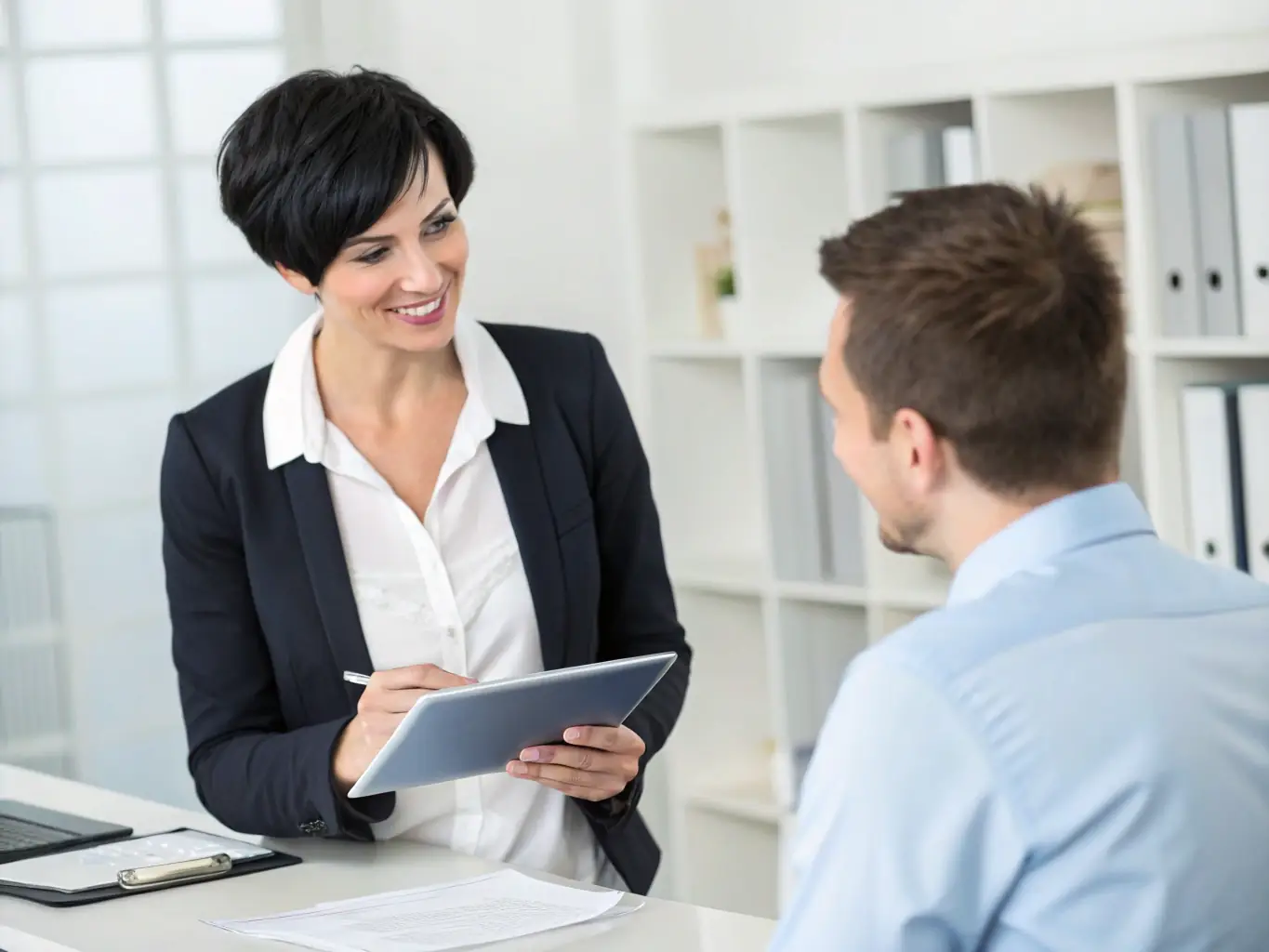 A coach working one-on-one with a startup founder, providing personalized guidance and support for leadership development.